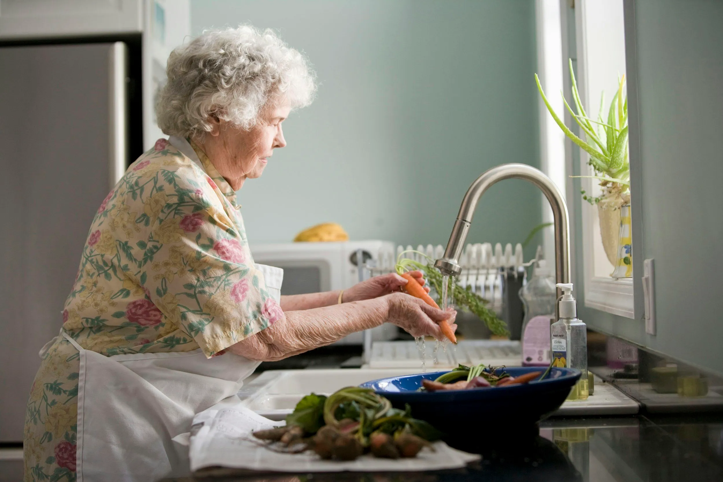 Older adult and family member sharing a quiet conversation